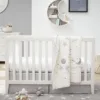 Dreamland Convertible Crib by bestever in white, featuring a classic design with solid wood construction and slatted sides. The crib easily converts into a toddler bed and daybed, offering longevity and versatility for your child's nursery. The crib has a spacious drawer underneath for additional storage and a non-toxic finish for safety