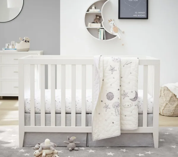 Dreamland Convertible Crib by bestever in white, featuring a classic design with solid wood construction and slatted sides. The crib easily converts into a toddler bed and daybed, offering longevity and versatility for your child's nursery. The crib has a spacious drawer underneath for additional storage and a non-toxic finish for safety