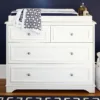 CozyCradle Dresser & Topper Set in a nursery setting, featuring spacious drawers and a removable changing topper for added convenience and style.