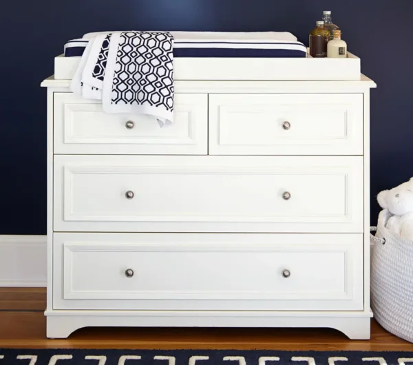 CozyCradle Dresser & Topper Set in a nursery setting, featuring spacious drawers and a removable changing topper for added convenience and style.