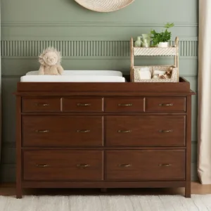 PureComfort Extra Wide Dresser & Topper Set in a nursery, showcasing six spacious drawers and a removable changing topper for added versatility and style.